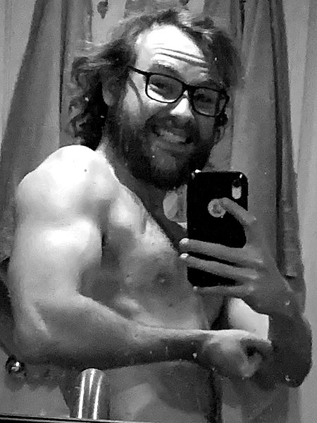 Miller grinning mid-flex